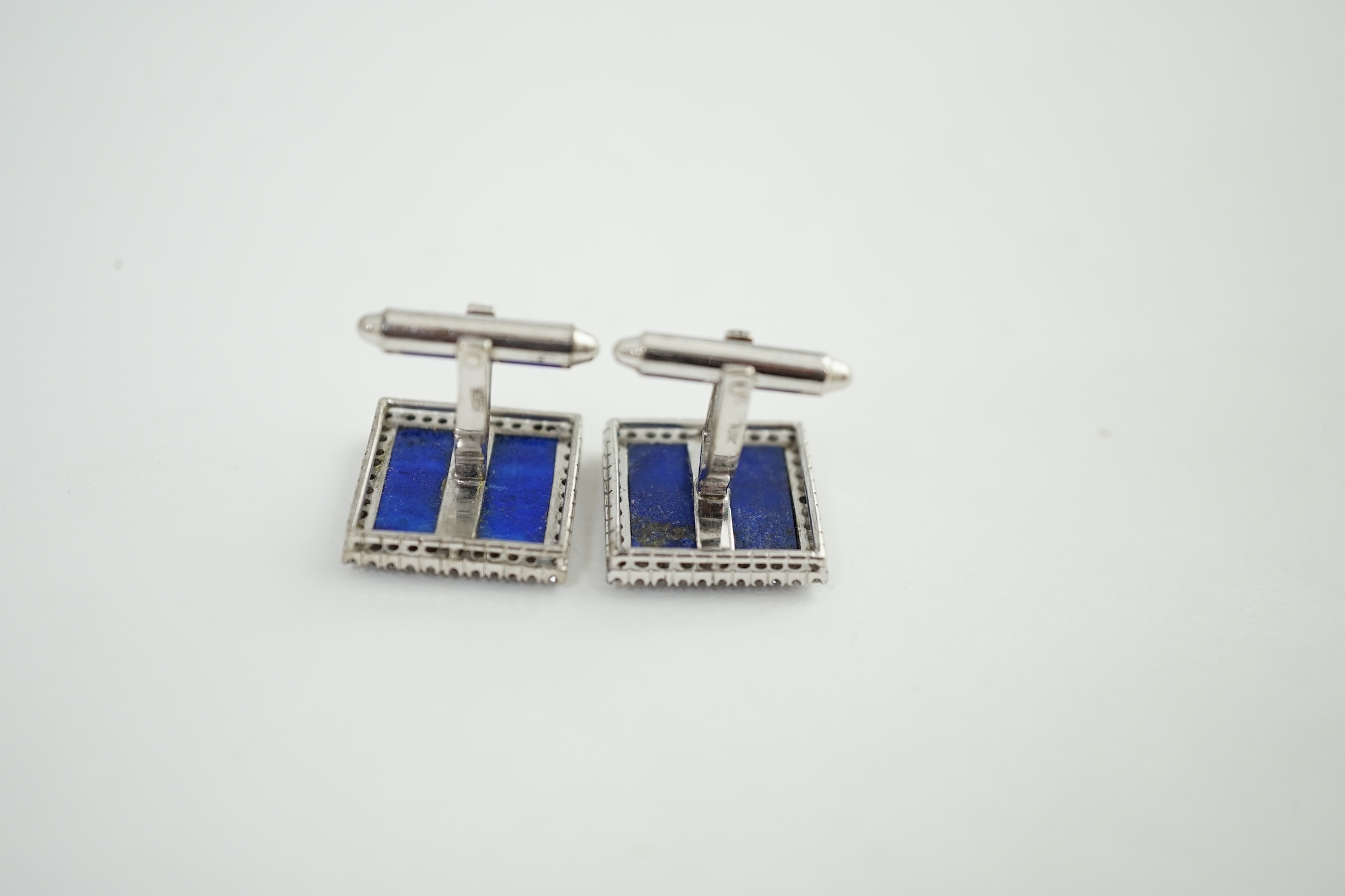 A pair of 18K white gold, lapis lazuli and diamond set tablet cufflinks, each lapis stone surrounded by forty claw set diamonds